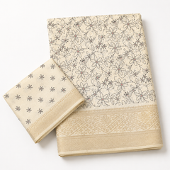 Elegant Cream Chiffon Saree with Black Floral Design & Gold Border