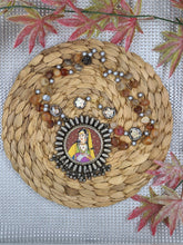 Silver Circular Pendant with Red Central Picture