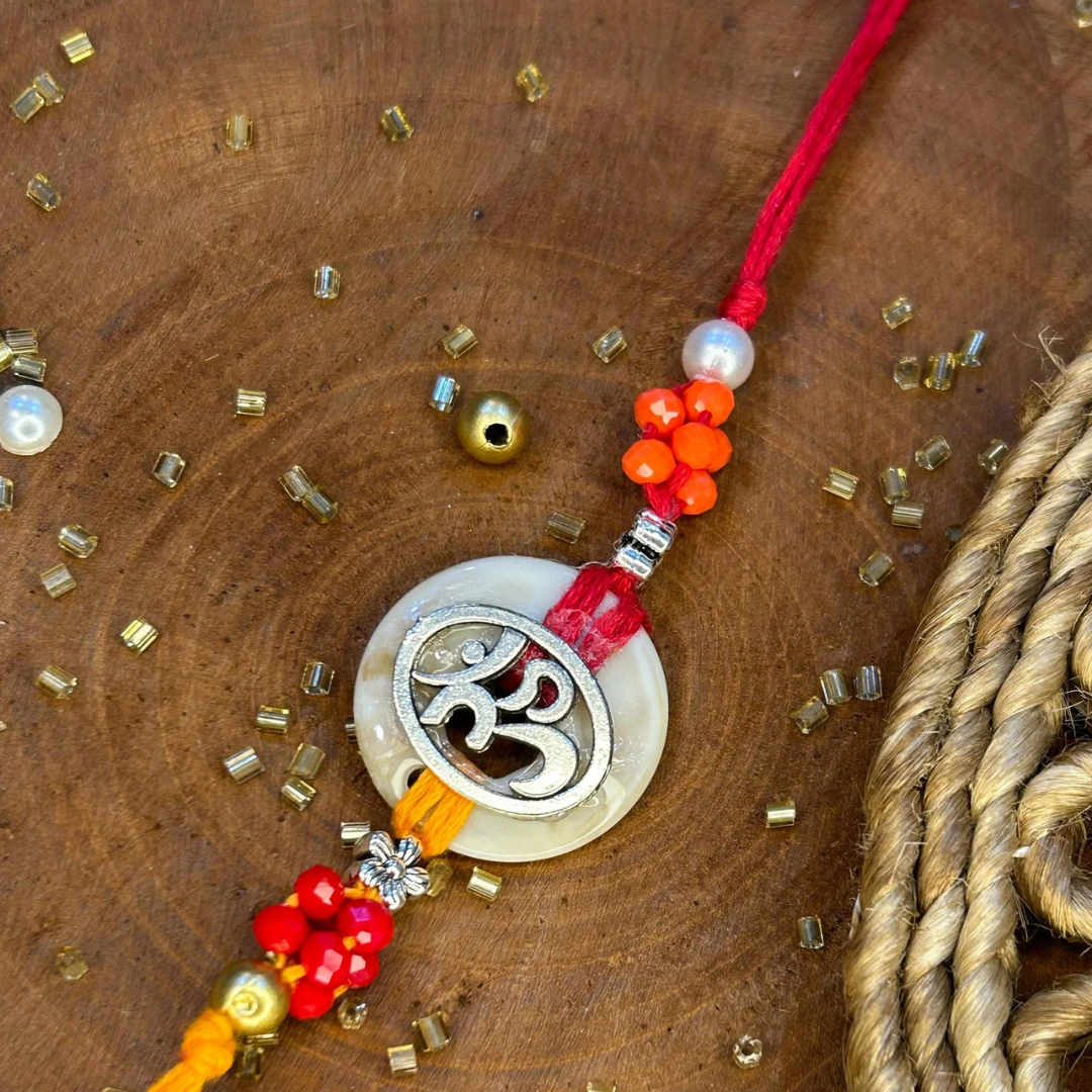 Silver Metal OM Charm Rakhi with Beads