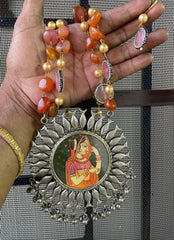 Silver Circular Pendant with Orange Central Picture